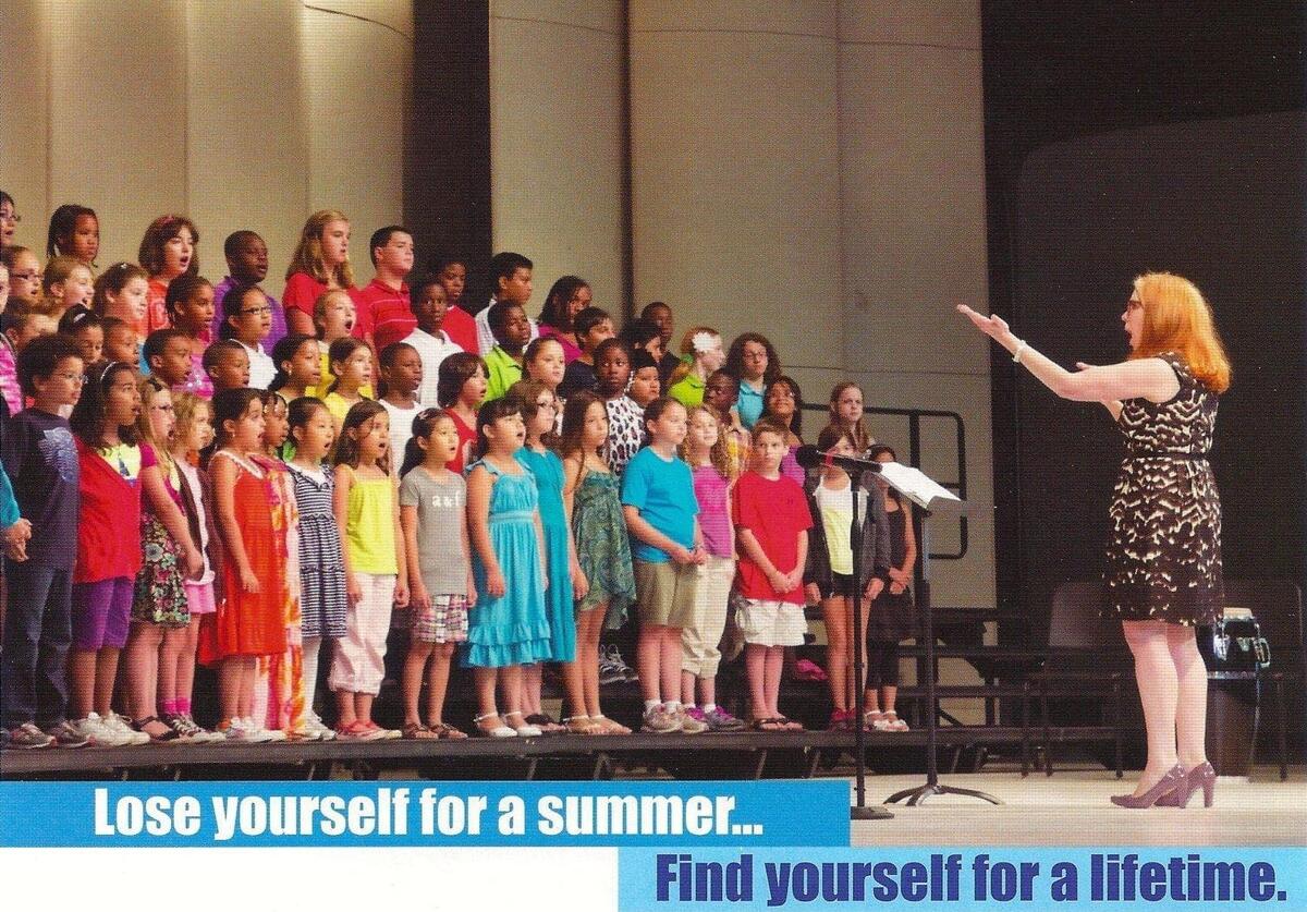 Eileen Powers Benedict Powers conducts a vocal ensemble in an old Usdan