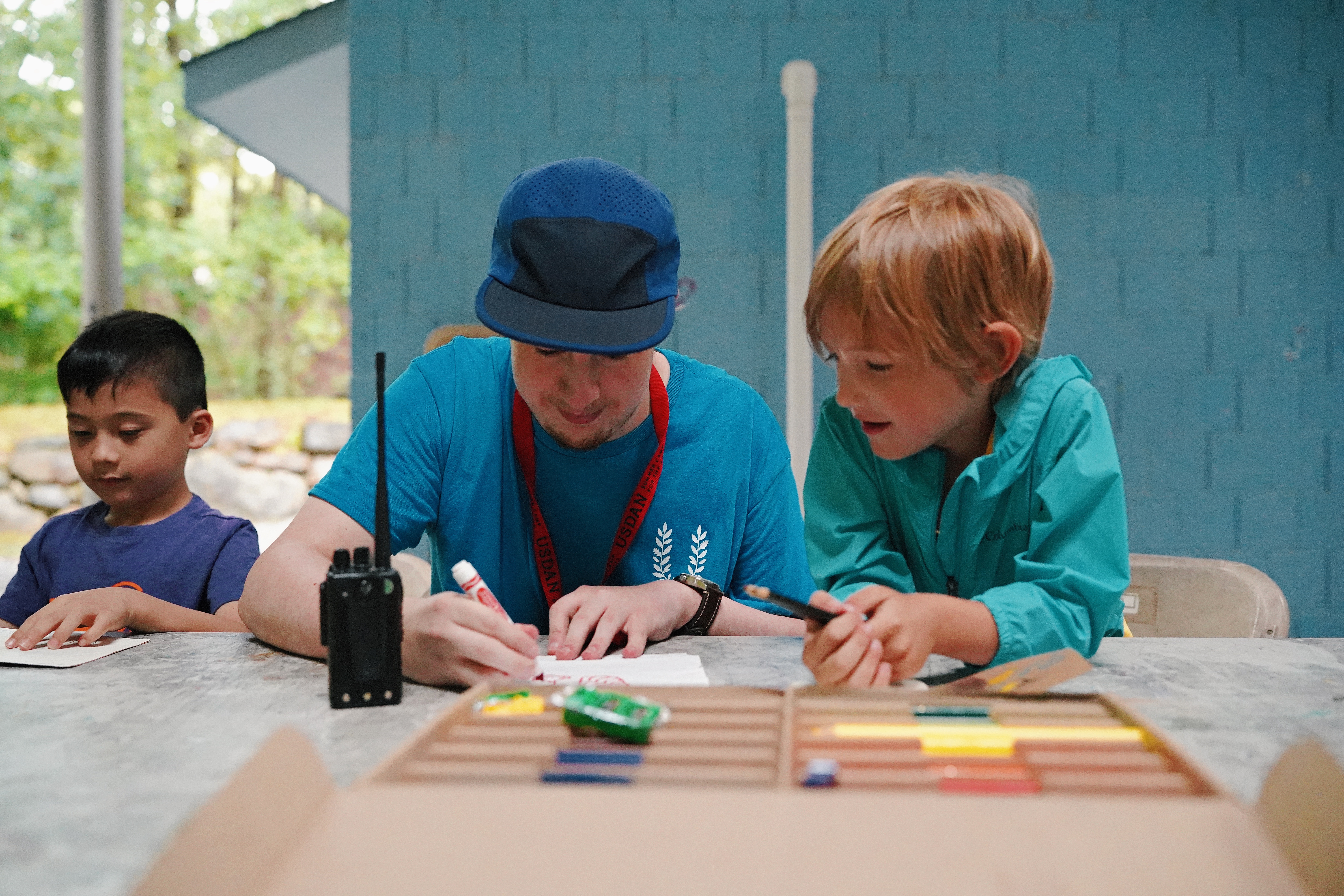 Discovery counselor teaching a Discovery student how to draw, 2026 