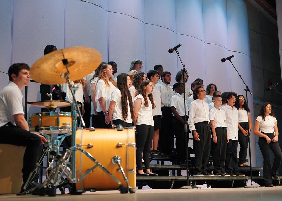 The Senior Vocal Ensemble closed out their performance with an arrangement of Simon and Garfunkel's "Bridge Over Troubled Water" accompanied by student percussionist Matt A.