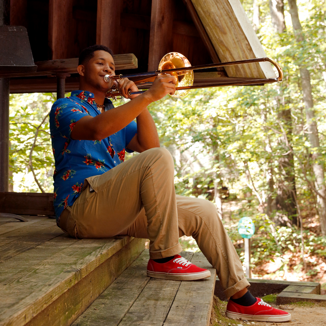 Usdan student playing the trombone