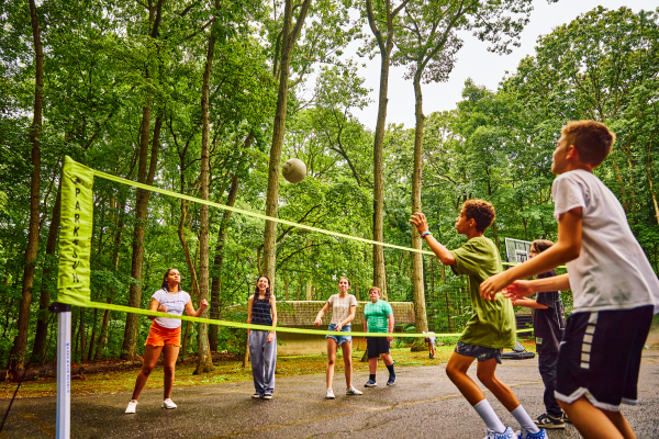 Campers playing volleyball