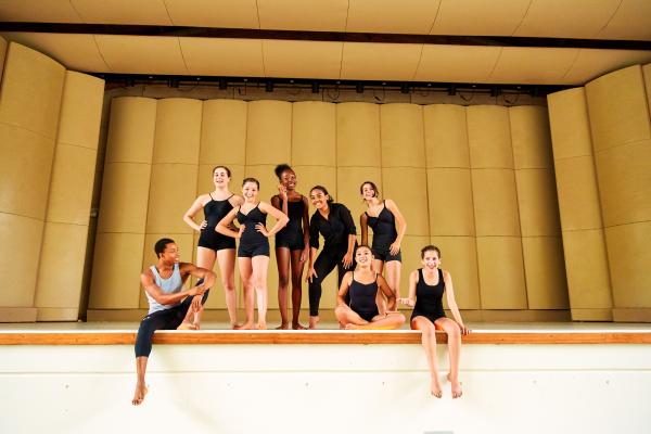 Dancers at Summer Dance Camp on Long Island sitting on stage and smiling