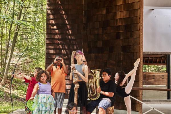 Kids of all ages posing and representing different art forms 