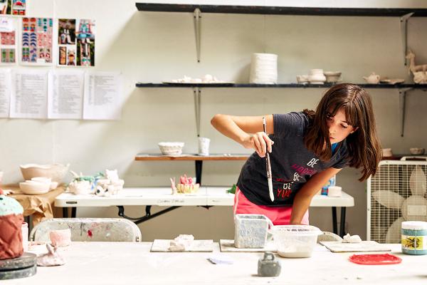 usdan student paints pottery