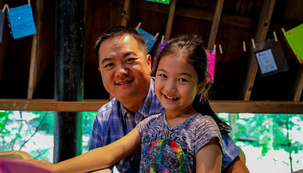 A father and daughter in a studio at Usdan