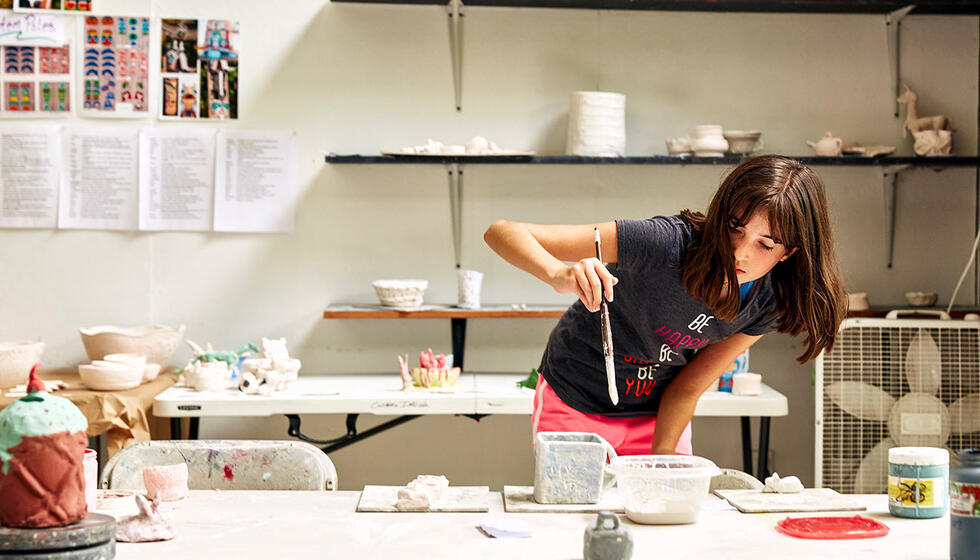 usdan student paints pottery