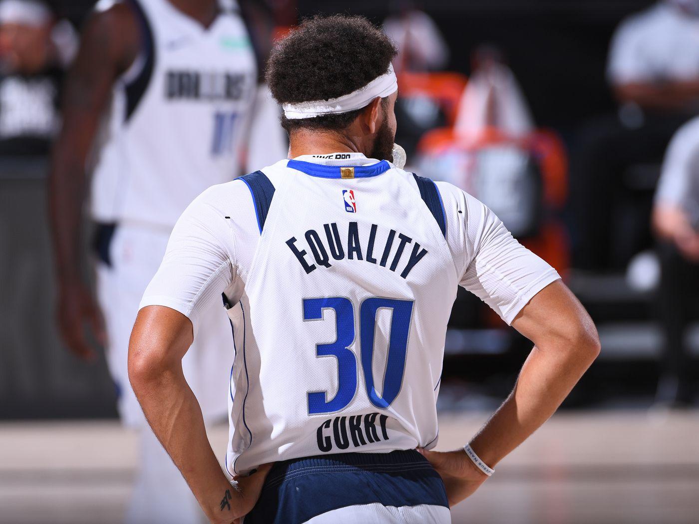 Basketball player with the words "Equality" written on the back of his jersey