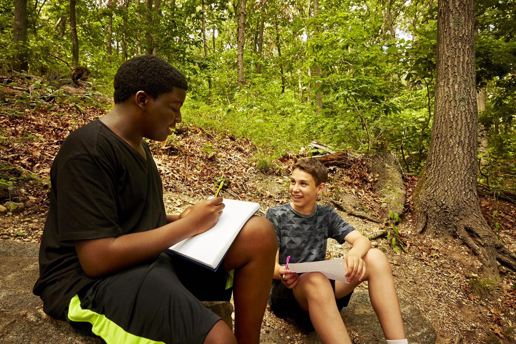 Students talking out in the woods