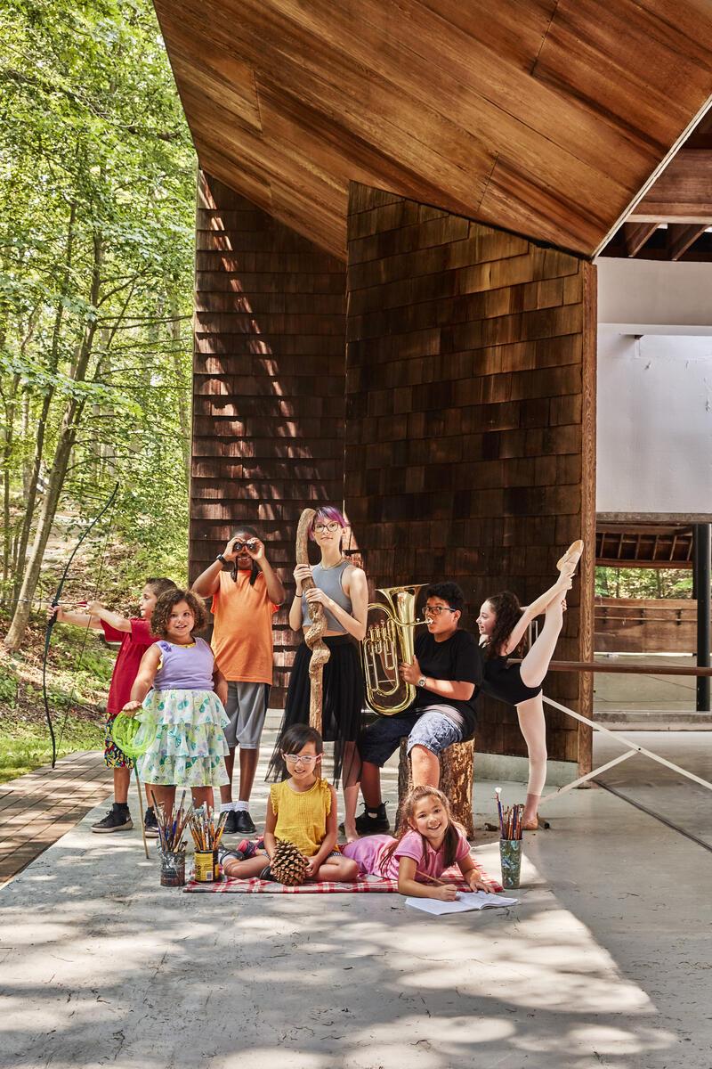 Kids of all ages posing and representing different art forms 