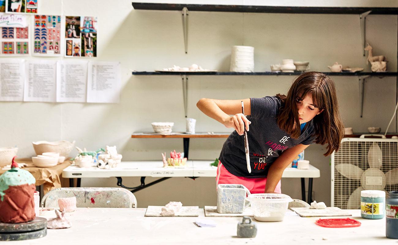 usdan student paints pottery