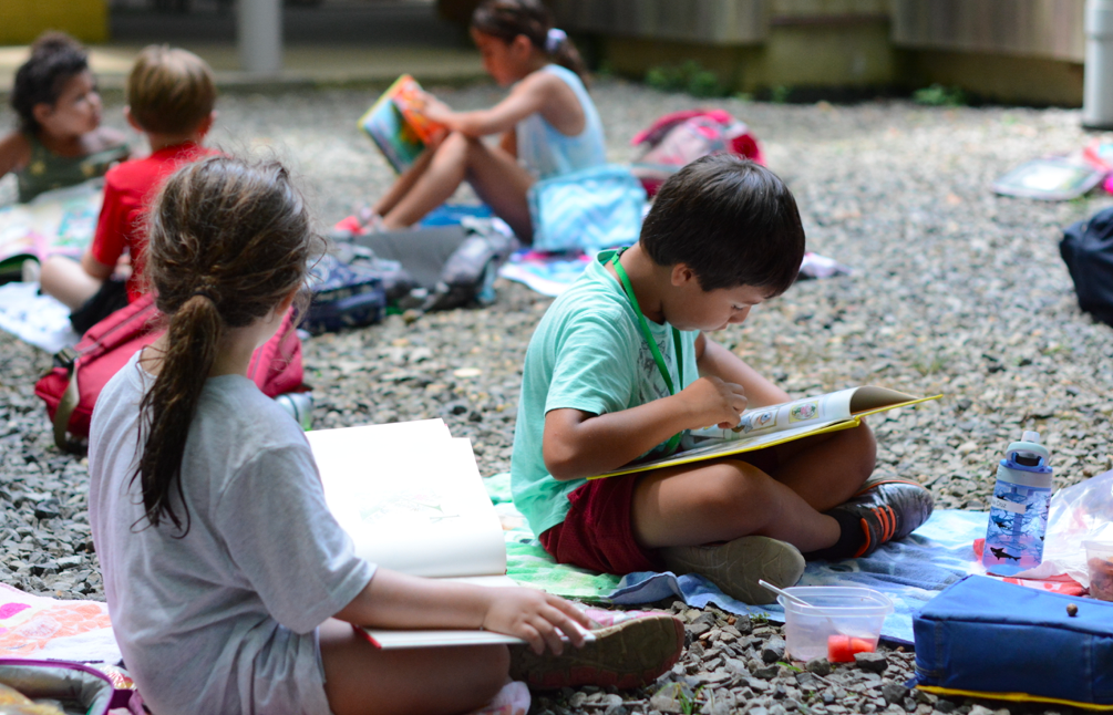 students study on the gravel outside