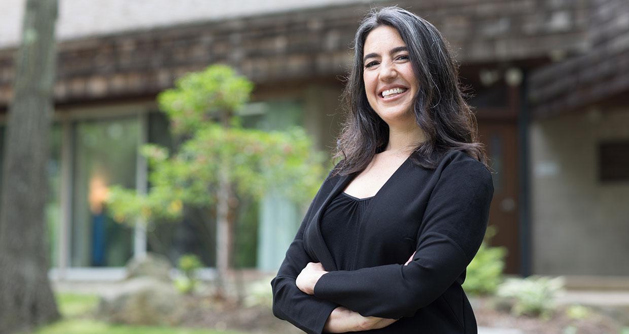 Lauren standing in front of the Usdan Administrative building