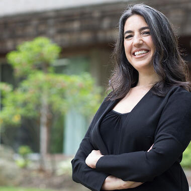 Lauren standing in front of the Usdan Administrative building.