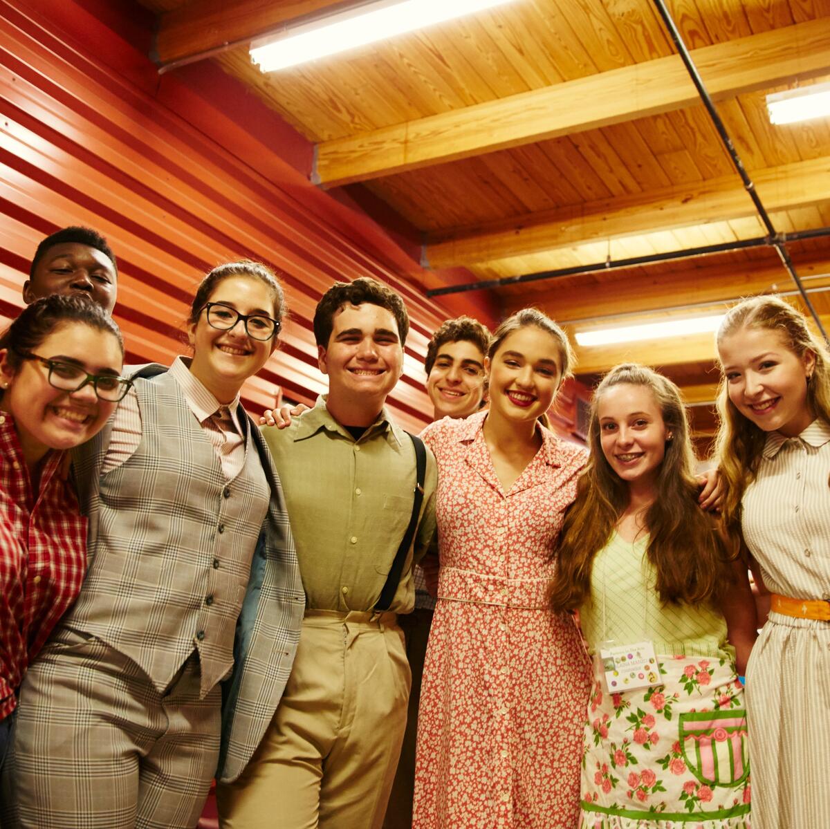 Usdan theater students smile backstage